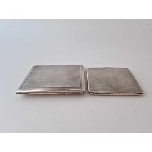 996R - Two cigarette cases, one applied with a crest. 220gms