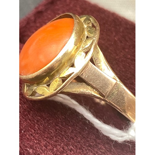 569 - A coral set ring 14ct gold tested size W 5.9 gms