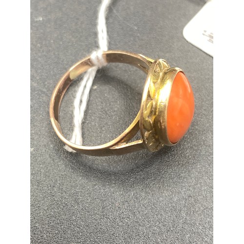 569 - A coral set ring 14ct gold tested size W 5.9 gms