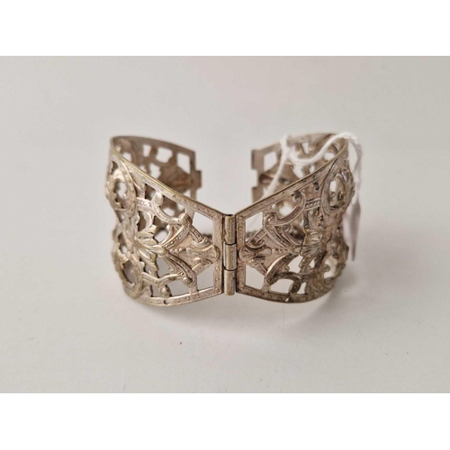 109 - A large silver floral design hinge bangle 46 g