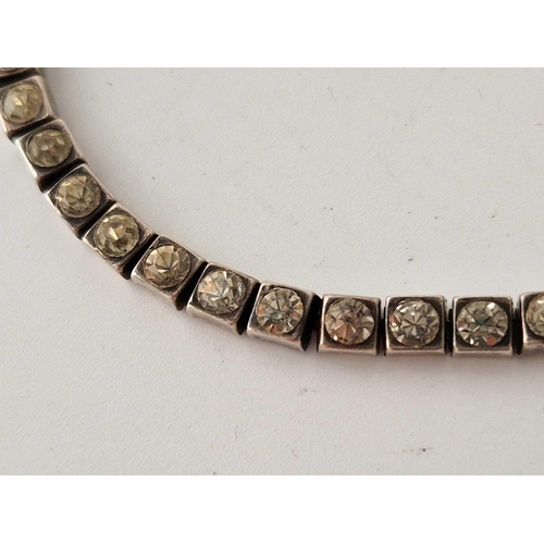 129 - A silver white stone bracelet