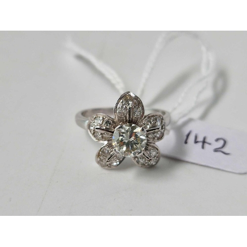 142 - A very attractive 18ct gold and platinum diamond flower head cluster ring with large central diamond... 