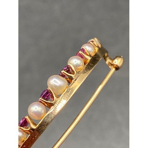 158 - A antique pearl and pink sapphire crescent brooch in high carat and platinum 2 g