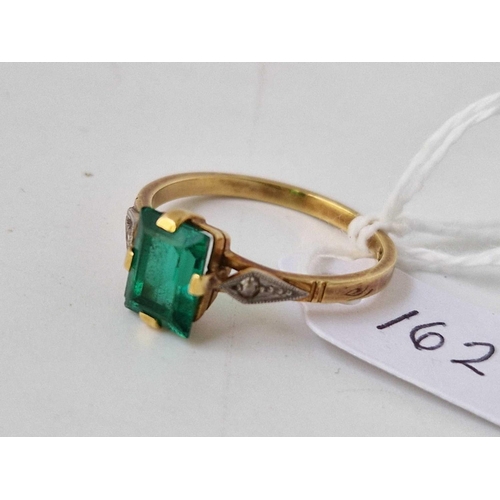 162 - A green stone ring with diamond shoulders, 18ct, size R, 3.2 g