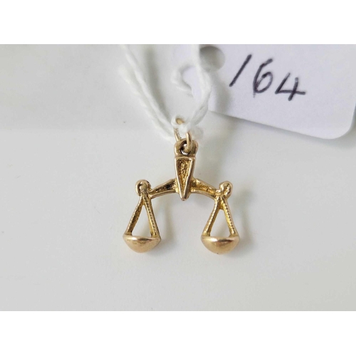 164 - A Libra scales charm, 9ct