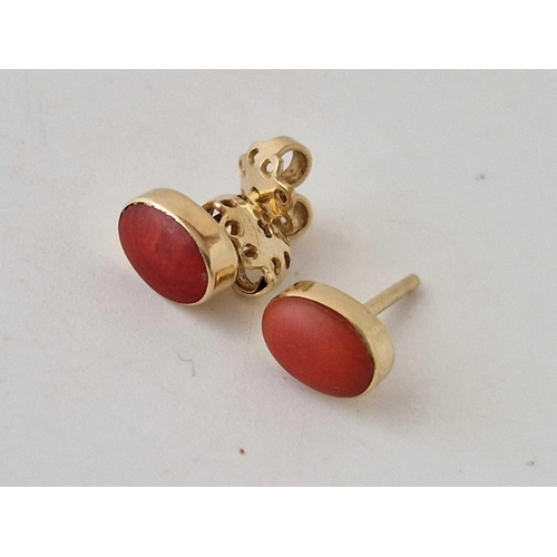 200 - A pair of coral ear studs, 18ct, 1.8 g