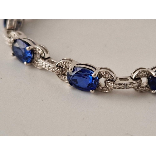 204 - A silver sapphire blue stone bracelet 13.5g