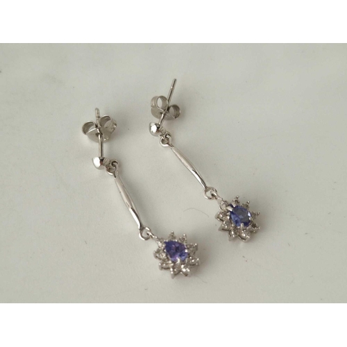 212 - A pair of diamond and tanzernite drop earring 9ct