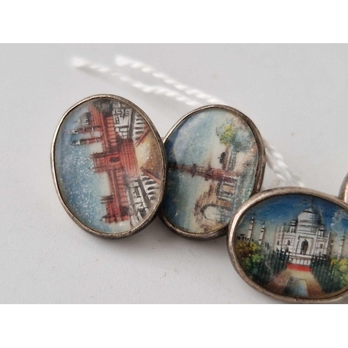 221 - A pair of silver cufflinks painted with Indian architecture