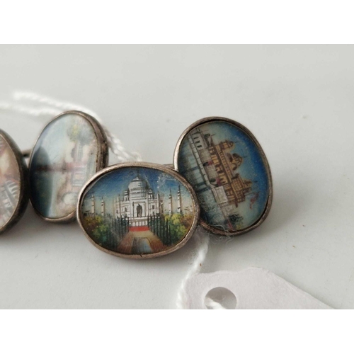 221 - A pair of silver cufflinks painted with Indian architecture