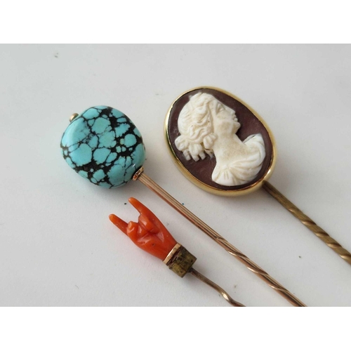 229 - Three stick pins, coral hand, cameo and turquoise matrix