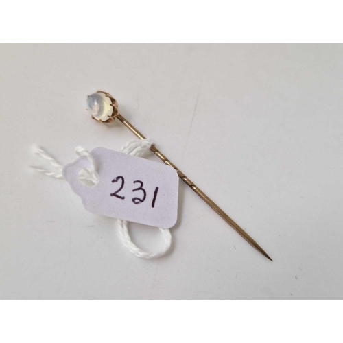 231 - A gold topped moonstone stick pin