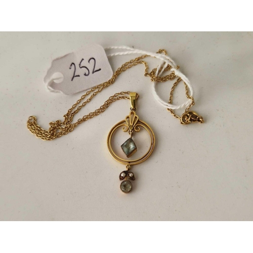 252 - An Edwardian aquamarine and pearl pendant and chain, 9ct, 16 inch