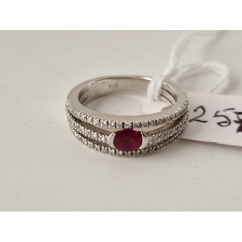 257 - A white gold ruby and diamond ring, 18ct, size L, 5.9 g boxed