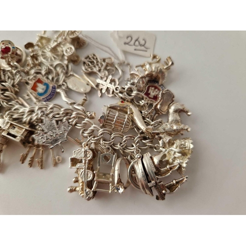 262 - A heavy vintage silver charm bracelet 102g