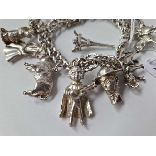 294 - A silver charm bracelet, 110 g