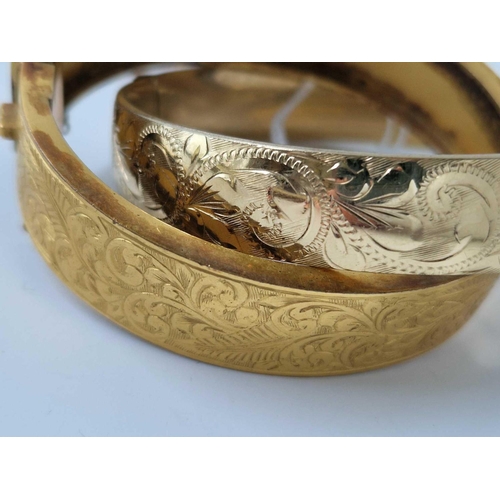 298 - Two rolled gold bangles