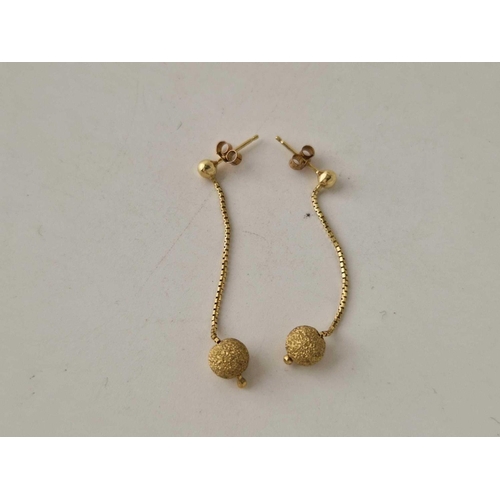 302 - A pair of 9ct drop earrings