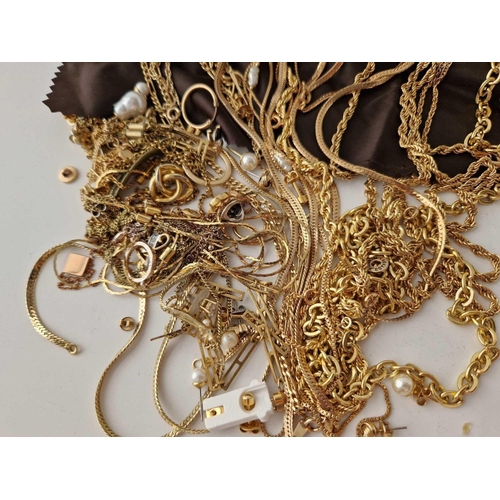 304 - A quantity of costume jewellery including a roll of chains