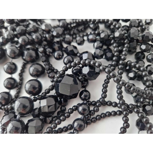 318 - 4 Antique black bead necklaces, 2 with facetted beads and 2 with plain beads