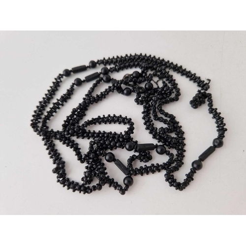 319 - Antique guard length woven black bead necklace