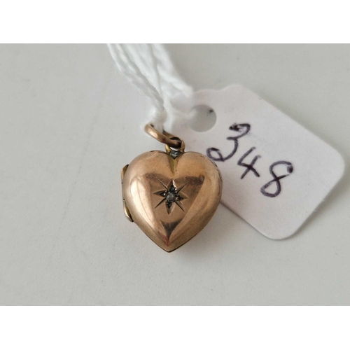 348 - A small gold heart shaped pendant locket, 2 g