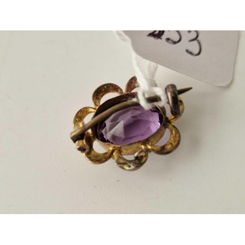 353 - An Edwardian amethyst and pearl brooch, 9ct