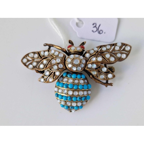 36 - An articulated silver, moonstone, turquoise and coral moth bug brooch