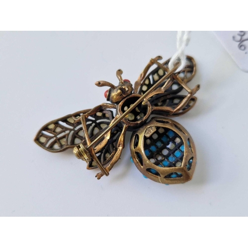 36 - An articulated silver, moonstone, turquoise and coral moth bug brooch