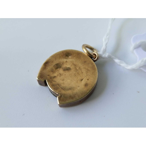 37 - A Victorian gold mourning locket horseshoe pendant