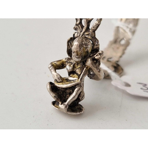 372 - A unusual silver scroll or wedding scroll holder with figure playing a musical instrument 26 g