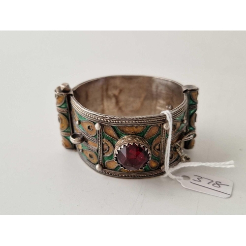 378 - A tribal silver and enamel cuff bangle hinged 64 g