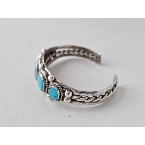 414 - Silver Navajo turquoise set bangle, unmarked