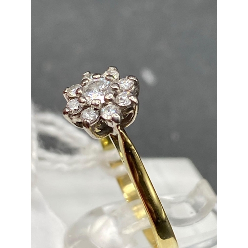 446 - A pretty diamond daisy cluster ring 18ct gold size J 2 g