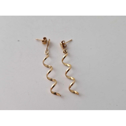 501 - A pair of spiral 9ct earrings