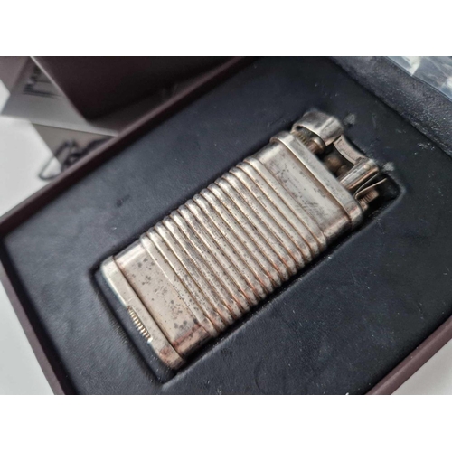 504 - A dunhill lighter in original box with papers