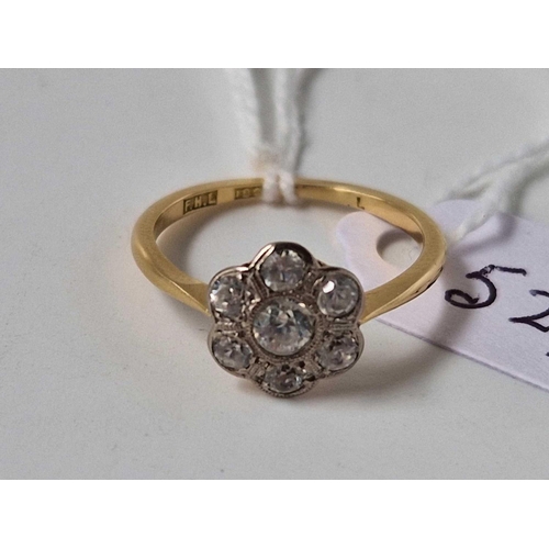 527 - A diamond daisy cluster ring, 18ct, size N, 2.4 g