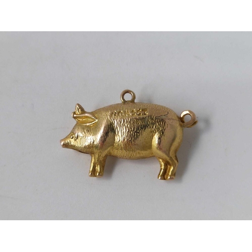 540 - A pig charm, named Aleck, 9ct