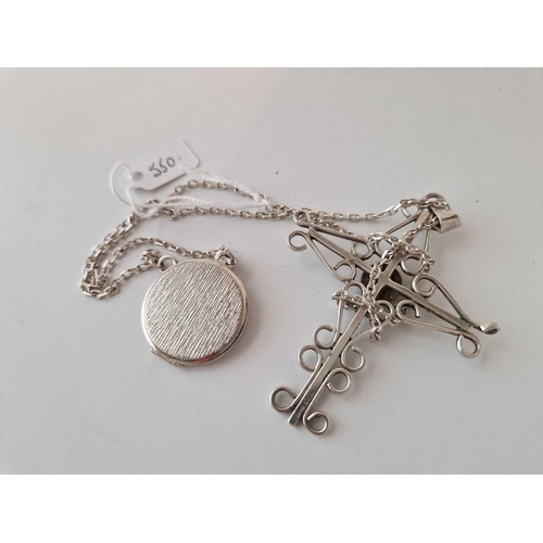 550 - A silver crucifix and chain and engraved locket 32 g