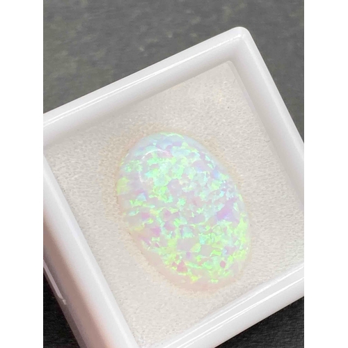 551 - A fine opal stone of 10 carats with fiery blue and green flashes