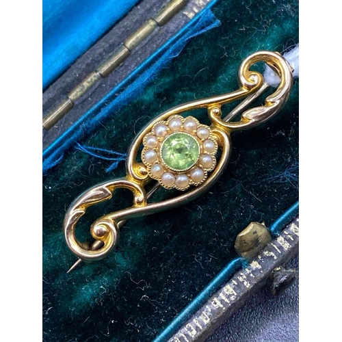 553 - A art nouveau peridot and pearl fancy brooch Chester 15ct gold in original box