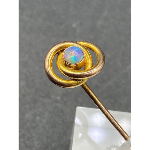 555 - A fine Victorian double loop opal stick pin with fiery colours