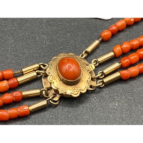 560 - A Early Victorian four row coral bead anklet necklace 10 inch with original 15ct gold and coral clas... 