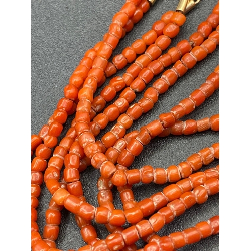 560 - A Early Victorian four row coral bead anklet necklace 10 inch with original 15ct gold and coral clas... 