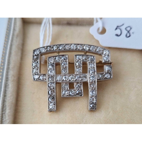 58 - AN ART DECO 18CT AND PLATINUM SET DIAMOND BROOCH, boxed