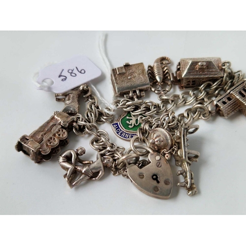 586 - A silver charm bracelet, 40 g