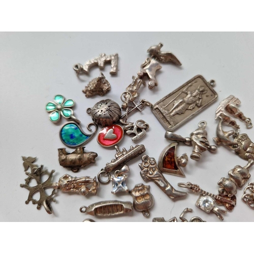 590 - A quantity of silver charms and pendants, 80 g