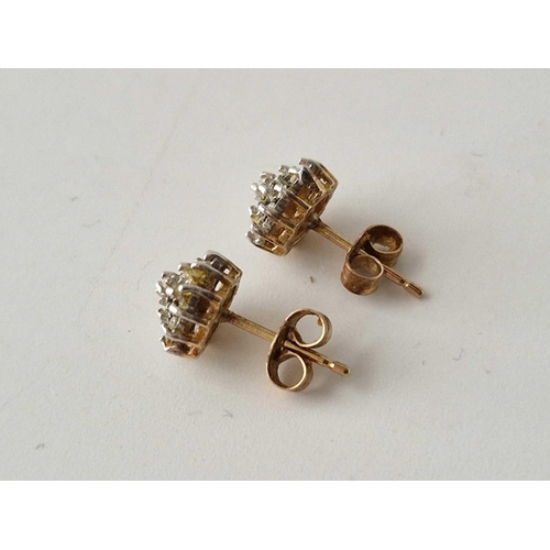 638 - A pair of diamond cluster ear studs, 9ct