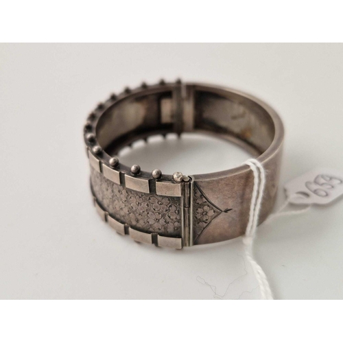 659 - A Victorian silver fancy bangle 31 g