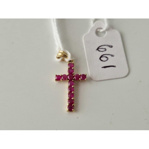 661 - A ruby set cross pendant, 9ct